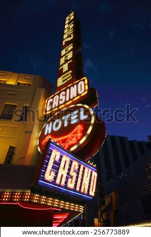 LAS VEGAS - AUGUST 14, 2014: Golden Gate Hotel & Casino sign illuminated by night, on August 14, 2014 in Las Vegas. It is the oldest and smallest hotel located on the Fremont Street Experience.