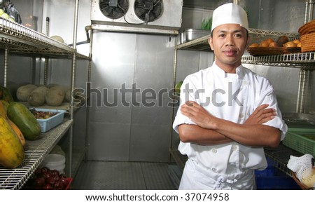 chef posing in refrigerator