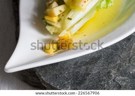 Romaine lettuce hearts with mango apple vinaigrette.