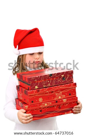 Small girl in Santa\'s red hat carrying three presents isolated on white