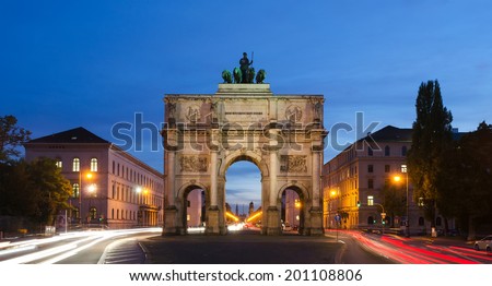 The Siegestor (english: Victory Arch) in Munich. This is a long exposure at dusk with traffic going around the arch