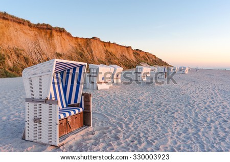 Similar – Foto Bild Rotes Kliff an der Küste der Insel Sylt bei Sonnenuntergang.  Leere Strandkulisse an der Nordsee