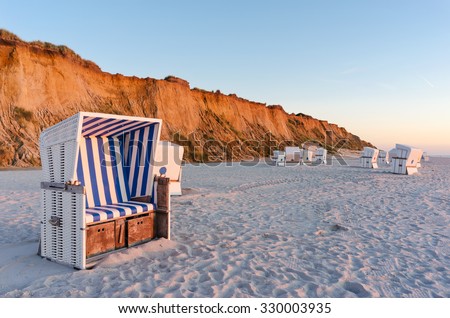 Similar – Foto Bild Rotes Kliff an der Küste der Insel Sylt bei Sonnenuntergang.  Leere Strandkulisse an der Nordsee