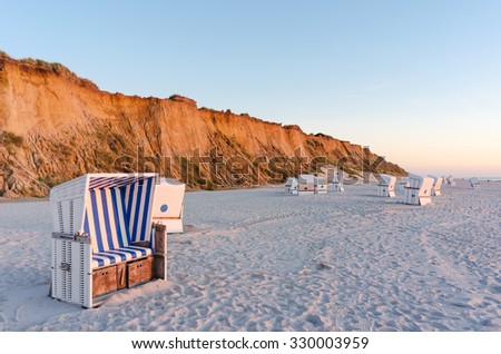 Similar – Foto Bild Rotes Kliff an der Küste der Insel Sylt bei Sonnenuntergang.  Leere Strandkulisse an der Nordsee