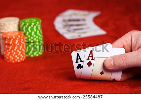 Hand keeping two ace cards
