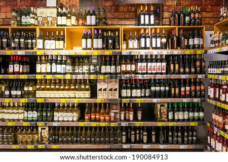 BUCHAREST, ROMANIA - APRIL 21, 2014: Wine Bottles On Supermarket Stand On April 21, 2014 In Bucharest, Romania. Red Wine is one of the most considered wines in Romania.