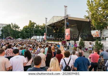 BUCHAREST, ROMANIA - JUNE 28, 2014: Crowd Of People Watching Free Classical Music Concert At Bucharest Music Film Festival In George Enescu Square Near The Romanian Athenaeum.
