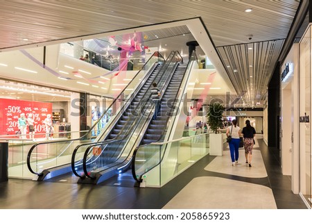 BUCHAREST, ROMANIA - JULY 18, 2014: People Shopping In Luxury Shopping Mall Interior.
