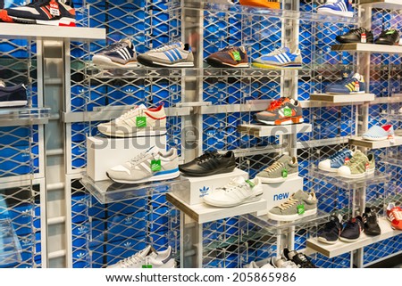 BUCHAREST, ROMANIA - JULY 18, 2014: Adidas Shoes In Shoe Store Display. Is a German multinational corporation that designs and manufactures sports clothing and accessories based in Germany.