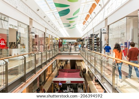 BUCHAREST, ROMANIA - JULY 21, 2014: People Shopping In Luxury Shopping Mall Interior.