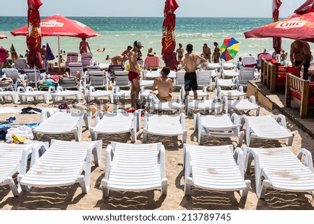 COSTINESTI, ROMANIA - JULY 31, 2014: People Enjoying Hot Weather On Costinesti Resort At The Black Sea Beach.