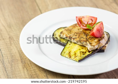 Grilled Aubergine Slice With Pork Steak And Sliced Tomatoes