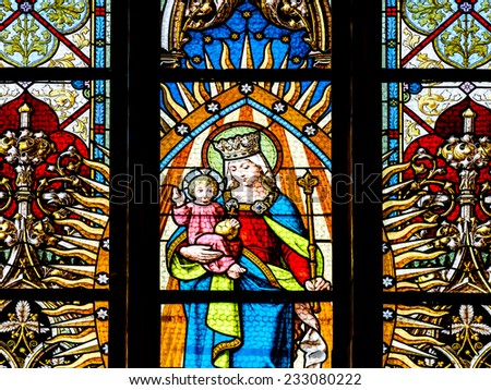 CLUJ NAPOCA, ROMANIA - AUGUST 21, 2014: Baby Jesus And Virgin Mary Stained Glass Window Inside The Gothic Roman Catholic Church of Saint Michael Built In 1390.