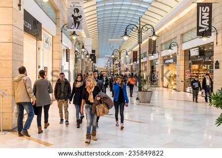 BUCHAREST, ROMANIA - DECEMBER 01, 2014: People Shopping For Christmas In Luxury Shopping Mall Interior.
