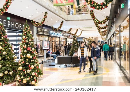 BUCHAREST, ROMANIA - DECEMBER 24, 2014: People Shopping For Christmas In Luxury Shopping Mall Interior.