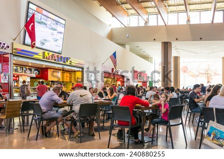TIMISOARA, ROMANIA - AUGUST 24, 2014: People Crowd Eating Fast Food On Restaurant Floor In Luxurious Shopping Mall.