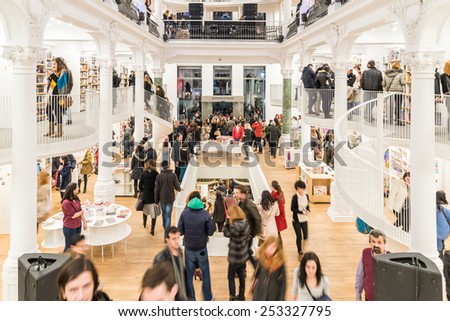 BUCHAREST, ROMANIA - FEBRUARY 13, 2015: People Shopping For Literature Books In Library.