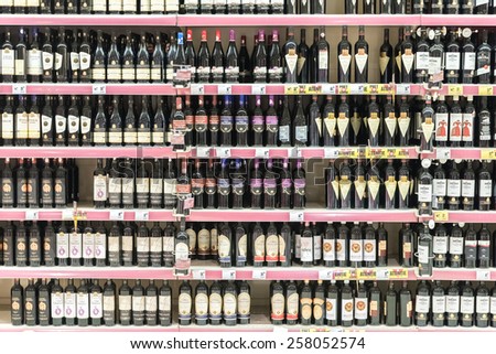 BUCHAREST, ROMANIA - MARCH 01, 2015: Red Wine Bottles On Supermarket Stand.
