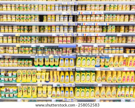 BUCHAREST, ROMANIA - MARCH 01, 2015: Mustard Bottles On Supermarket Stand.
