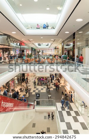 BUCHAREST, ROMANIA - JULY 08, 2015: People Crowd Rush In Shopping Luxury Mall Interior.