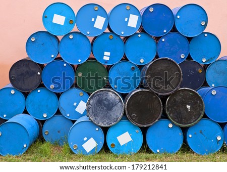 Blue barrels or tanks on grass. oil container, oil barrels