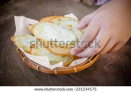 Toasted Cheese and Garlic Bread on wood table