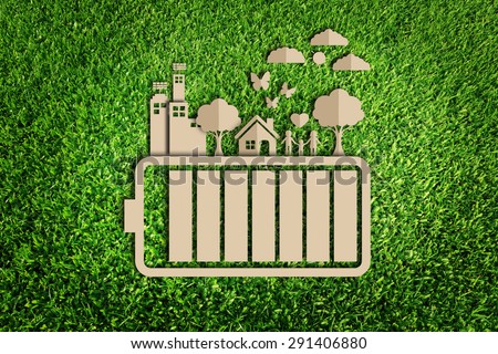 energy saving concept. Paper cut of eco on green grass.