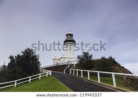 Australia Byron Bay lighthouse illuminated light at stormy dark weather nautical safety tower at hill coastline