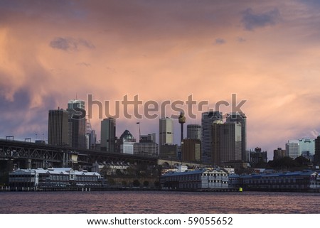 sydney city quay CBD skyscrapers under red cloudy sky during sunset thunderstorm weather