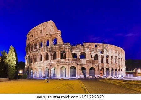 Italy Rome coliseum ruins at sunrise illuminated lights stone made ancient roman landmark