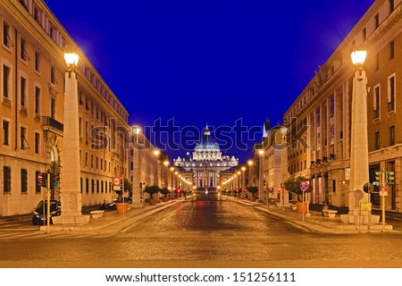 Italy ROme Vatican st peter cathedral at the end of the road city street illuminated with streetlights at sunrise houses and buildings