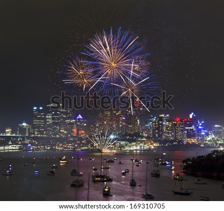 Australia Sydney New Year firework balls over harbour reflecting in the water with yachts
