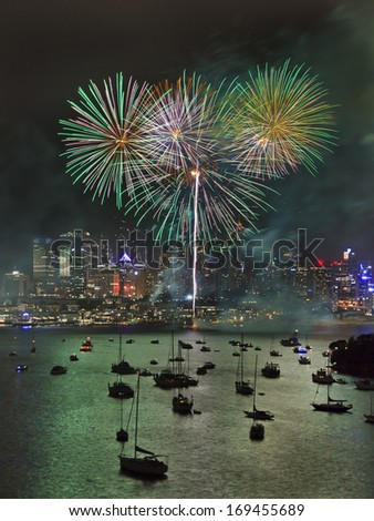 Australia Sydney city New Year midnight fireworks vertical green bunch of fire balls