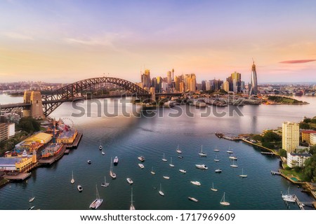 Sunrise in Sydney city - aerial view from Lavender bay to the Sydney harbour bridge and CBD skyline.