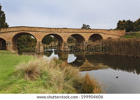 AUstralia Tasmania richmond old historic sandstone bridge constructed by convicts in British empire in 1832 still connecting banks of the river