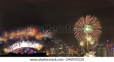 Australia Sydney New Year FIreworks over city CBD skyscrapers and harbour bridge panoramic view