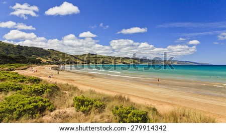 AUstralian apollo bay beach at summer time with relaxing and leisure people sunbathing and swimming