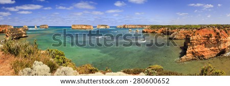 Great Ocean Road Boat bay panoramic view from elevated coastal lookout on sunny summer day. Clean transparent water of southern ocean surrounded by sandstone rocks of scenic coastline