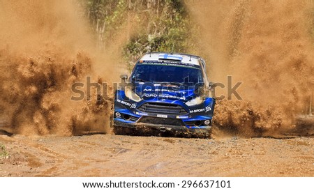 COFFS HARBOUR, AUSTRALIA - SEPTEMBER 14, 2014: Finnish crew M. HIRVONEN J. LEHTINEN M-Sport World Rally in a Ford Fiesta RS at WRC 2014 race with water splash