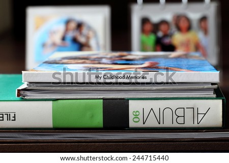 Photo Albums, Photo Books and Childhood Memory Photos on Wooden Desk