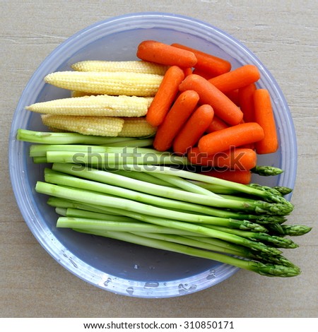 Washed and Cut Vegetables on Blue Plate Ready to be Used as Ingredient of Recipe
