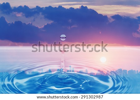 Water droplet with cloud and sunset sky   reflection