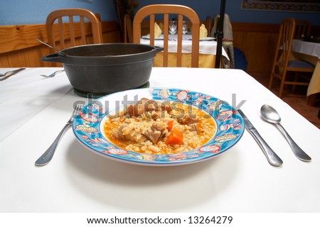 typical spanish soup with rice, meat and vegetables