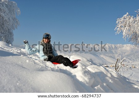 young woman outdoor in winter enjoying the snow
