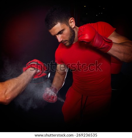 personal trainer man coach and man exercising boxing in the gym