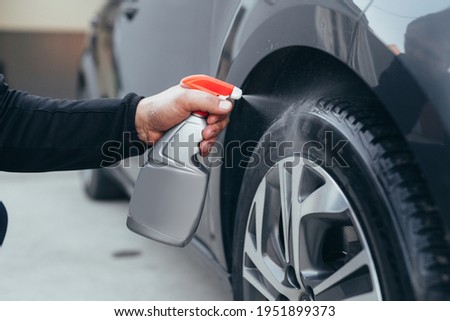 close up man cleaning car tires in carwash service Stock fotó © 
