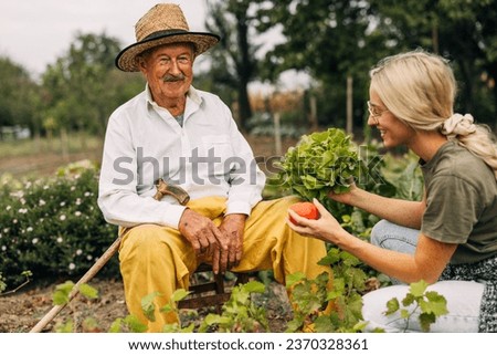 Similar – Image, Stock Photo Grandfather talking to his grandchildren and relatives, who were quarantined from home, about the coronavirus. Elderly man using smartphone and tablet in his office