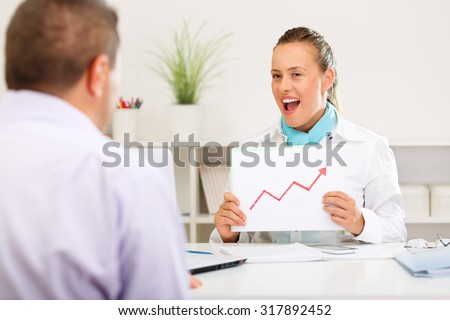Business consultant informing the client of growing interest rates