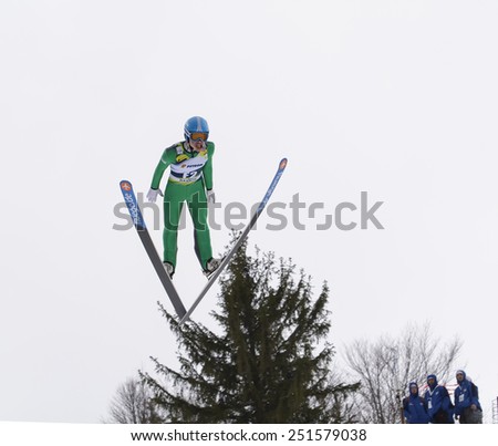 Rasnov, Romania - February 7: Unknown ski jumper competes in the FIS Ski Jumping World Cup Ladies on February 7, 2015 in Rasnov, Romania
