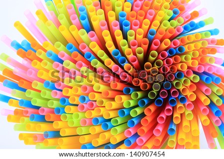 colorful drinking straws on white back ground, long plastic tubes